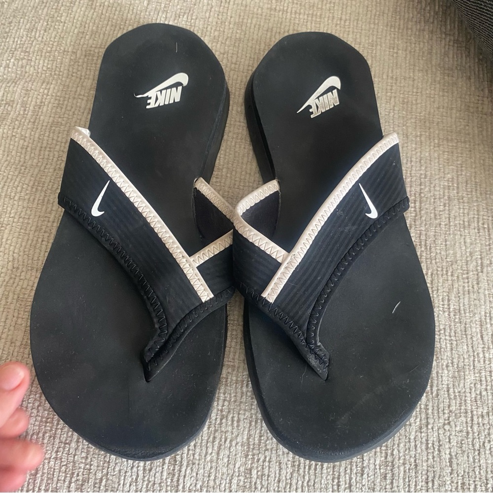 Nike Black Flip Flops with Beige Trim and White Swoosh